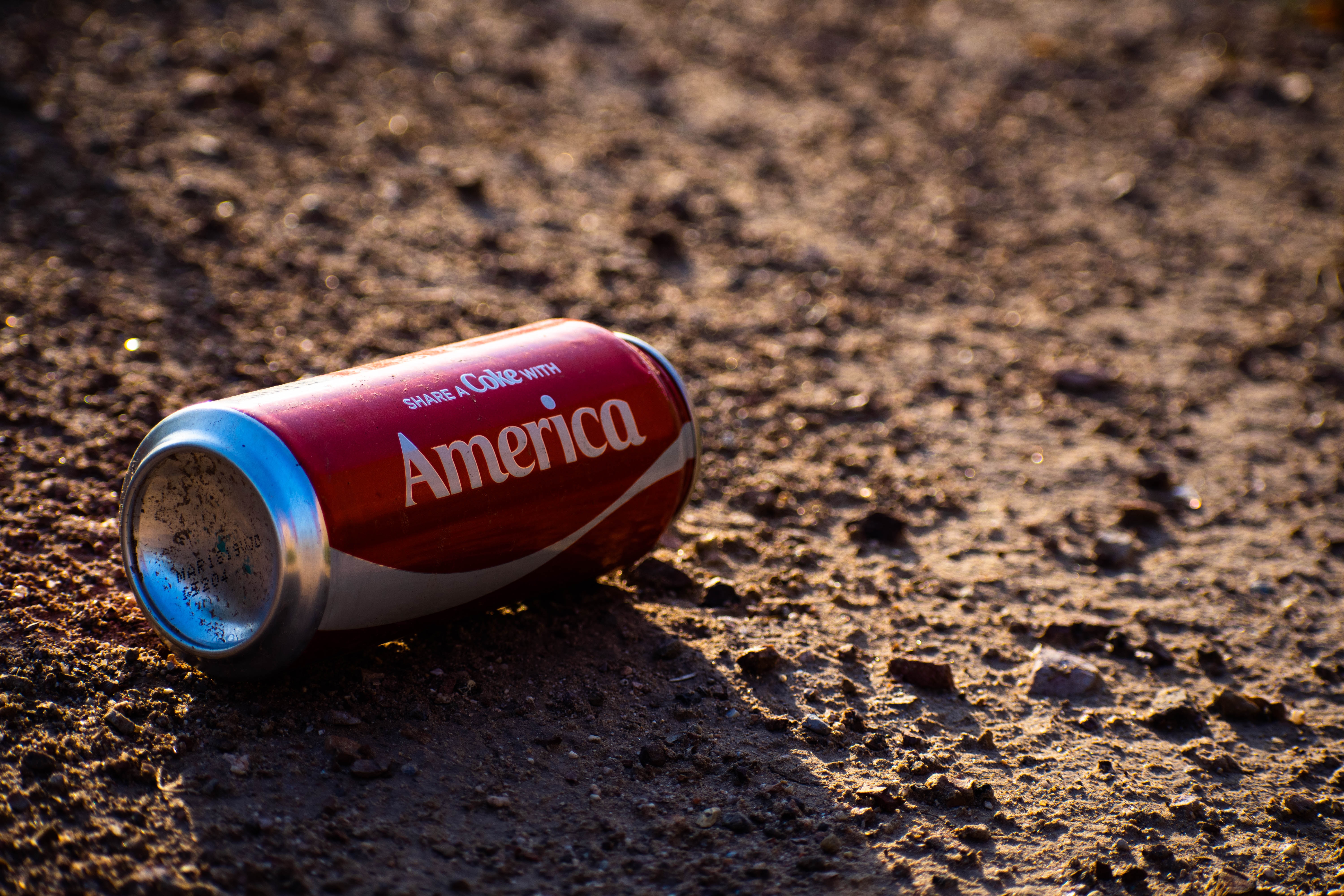 Aluminum Can on the ground with the word "America", intended to make us think of our stewardship responsibility to the planet and others.